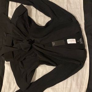 Black plunging neck peplum top NEW W TAGS